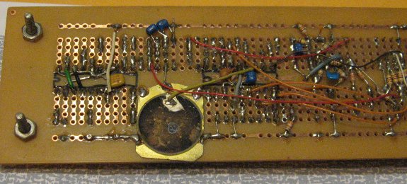 piezoelectric beeper on the back of a breadboard